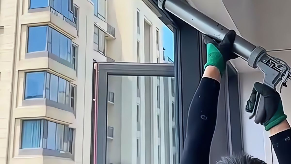 Curtain wall glazing installation where structural silicone sealant transfers wind load from the glass into the metal frame