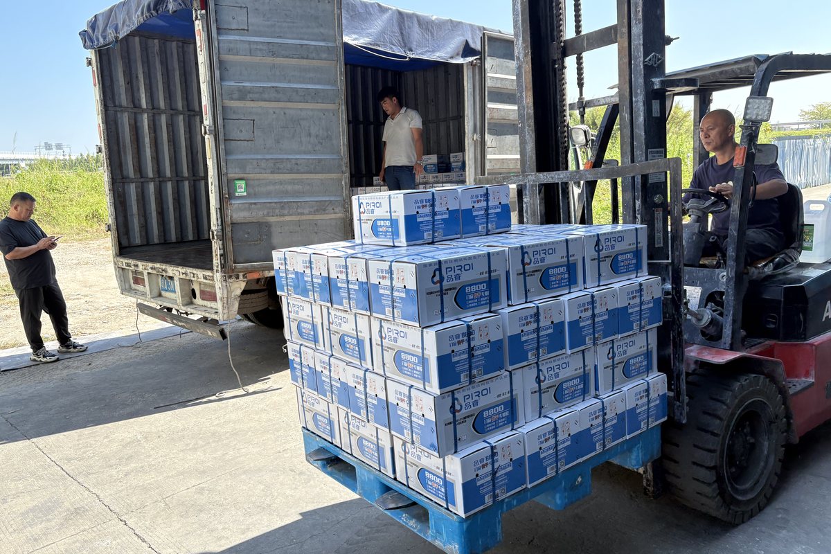Finished silicone sealant cartons palletised and ready for export shipment
