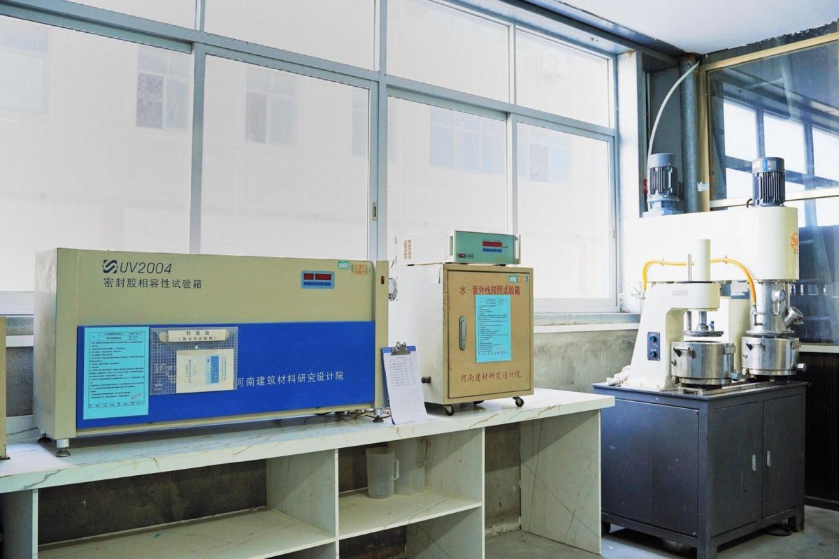 In-house silicone sealant testing laboratory with tensile and adhesion test equipment