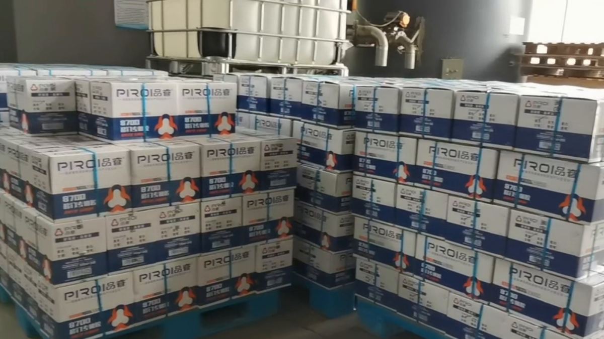 Pallets of silicone sealant cartons staged for container loading