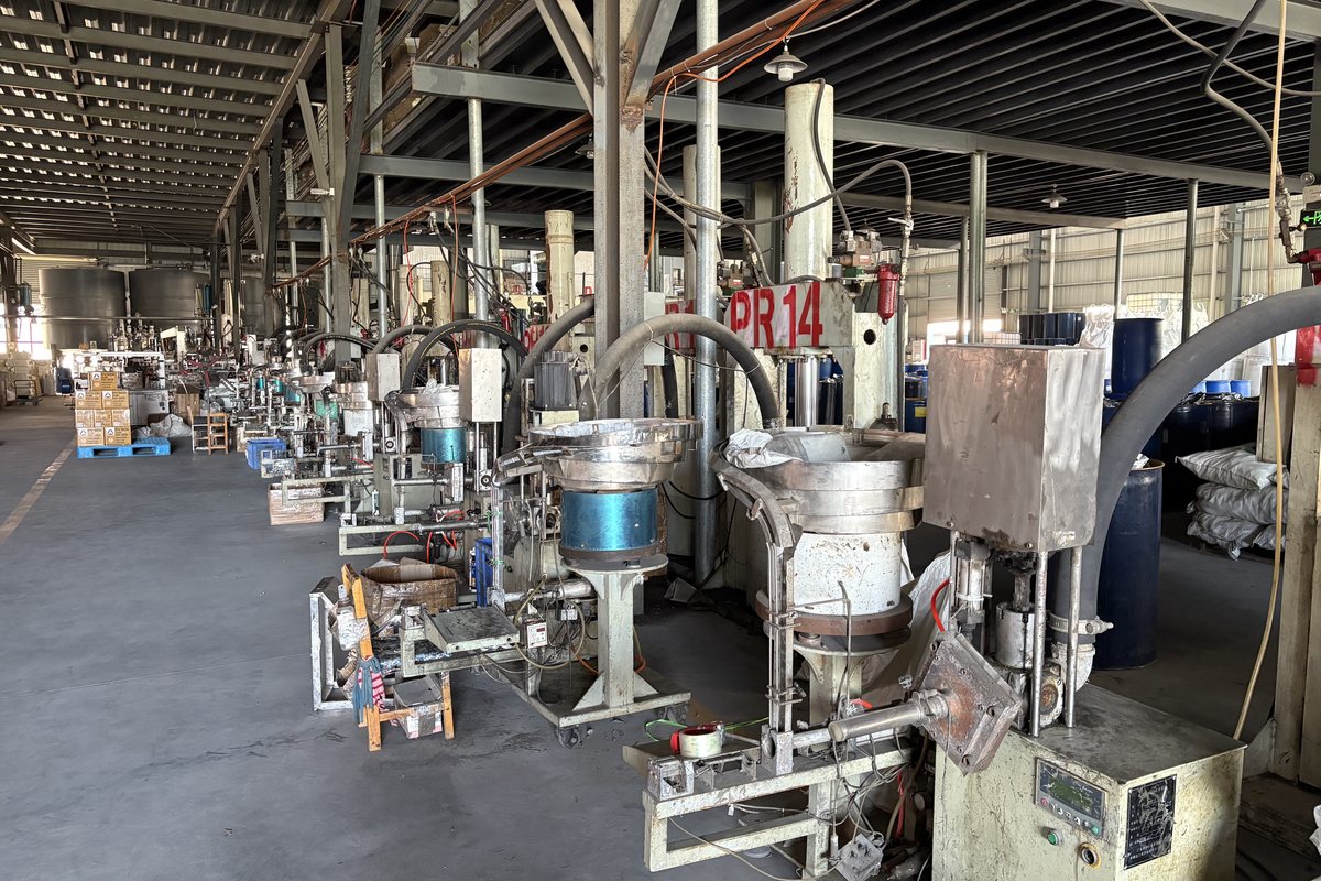 Silicone sealant workshop floor with mixing and filling equipment in operation